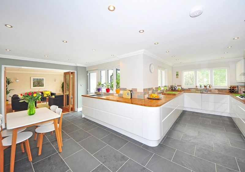 Renovated open-plan kitchen with island and dining area